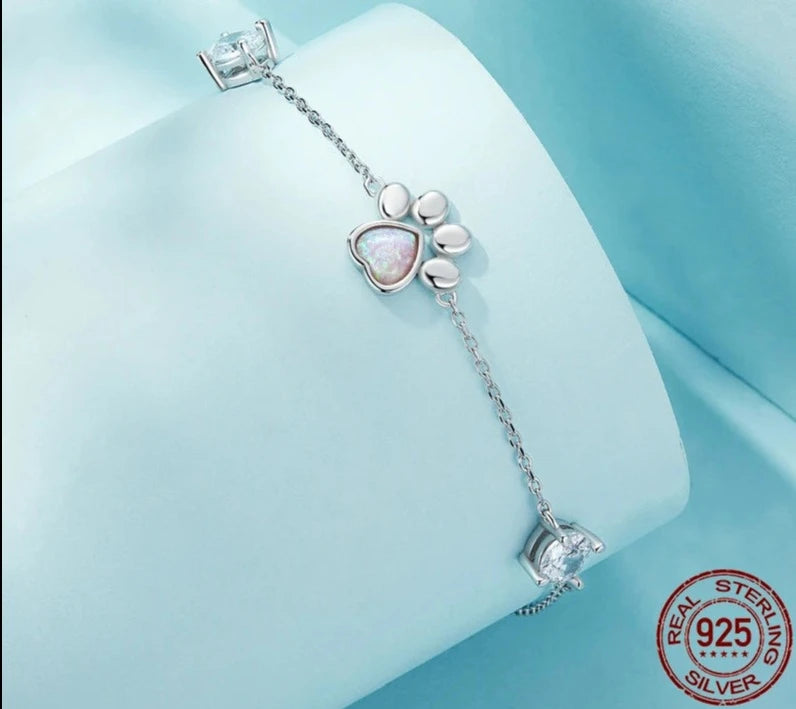 The delicate paw print shape combined with the Opal design is colorful and charming