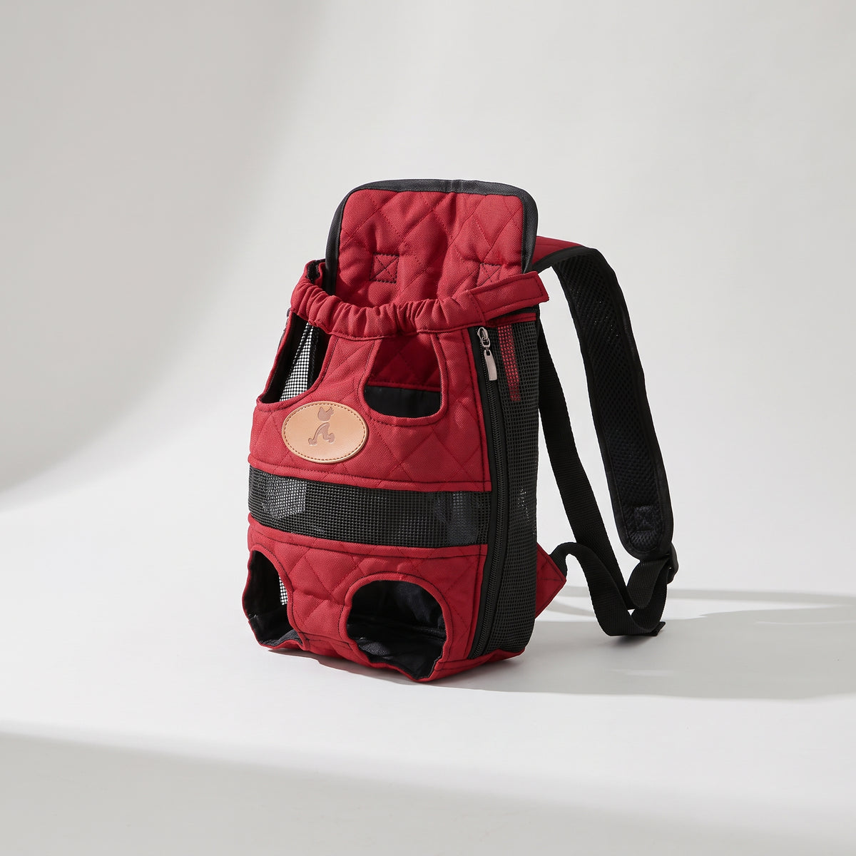 Red Backpack Dog Carrier for Hiking, studio photo on a light grey background
