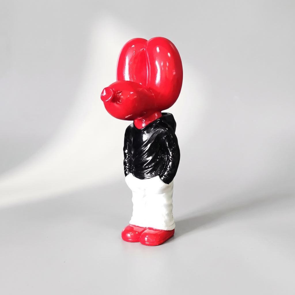 Cute Balloon Dog, studio photo on a light grey background
