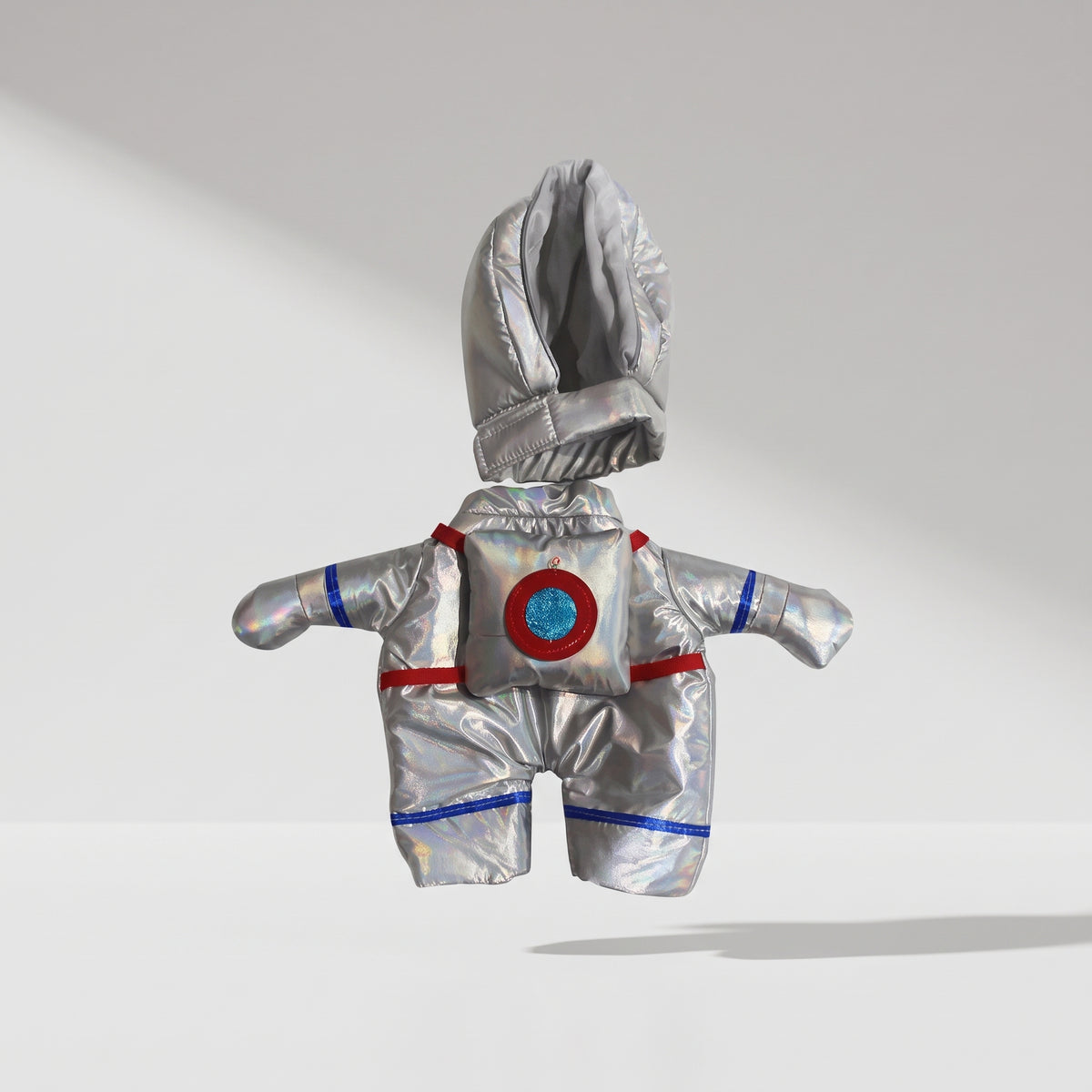 Dog Astronaut Costume, studio photo on a light grey background