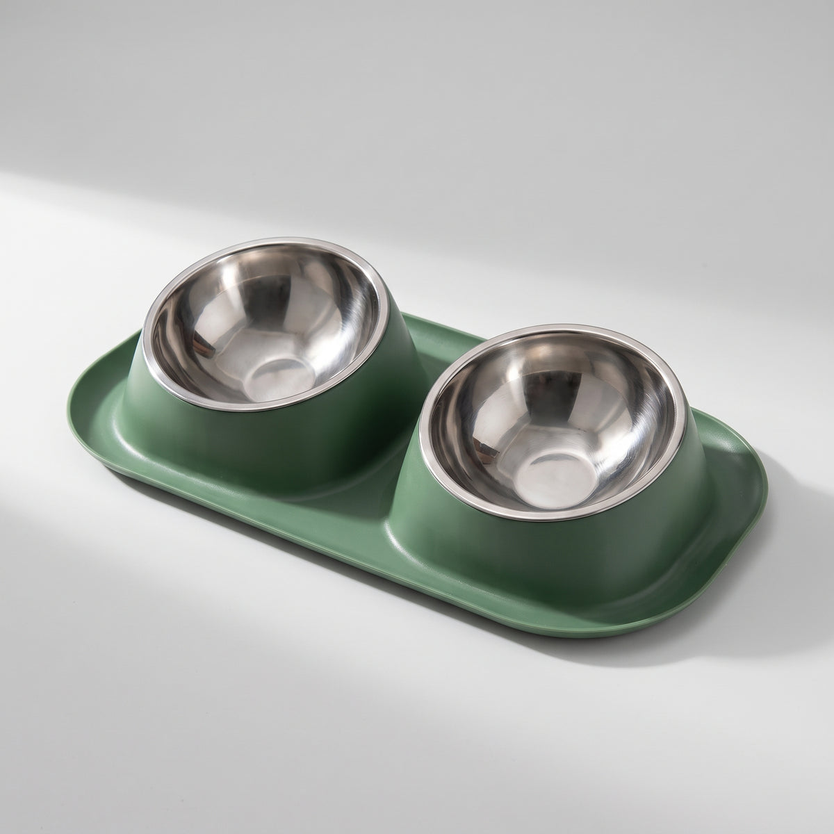 Dog Food And Water Bowls, studio photo on a light grey background