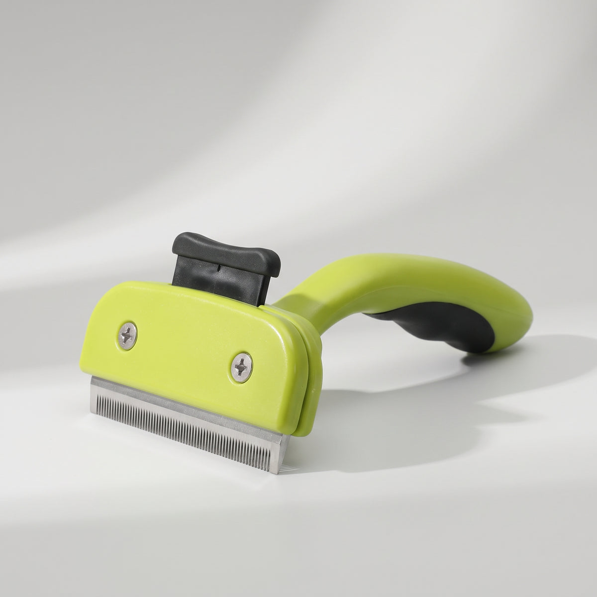 Dog Hair Brush Remover, studio photo on a light grey background