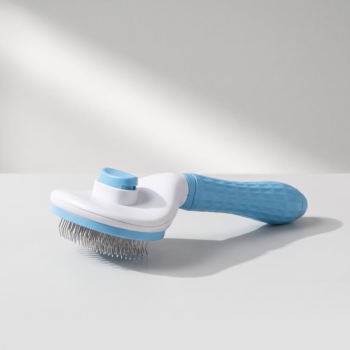Dog Hair Brush, studio photo on a light grey background