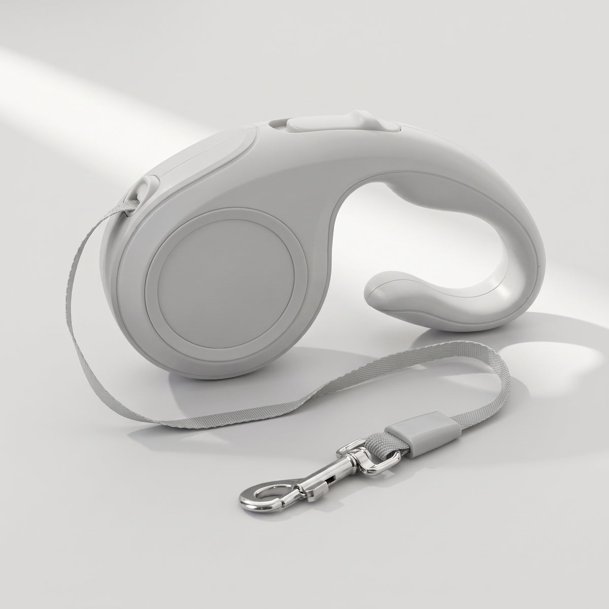 Retractable Dog Leash with Brake Button, studio photo on a light grey background