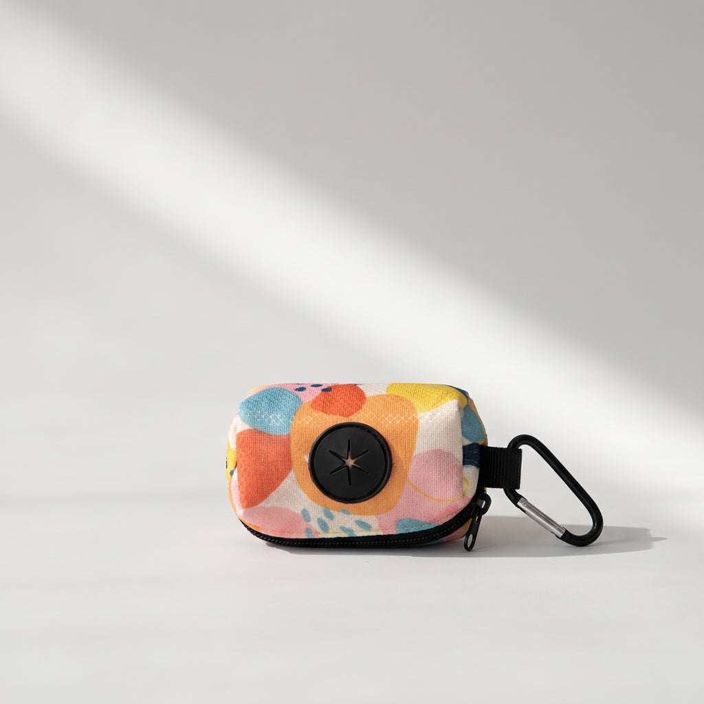 Dog Poop Bag Dispenser, studio photo on a light grey background