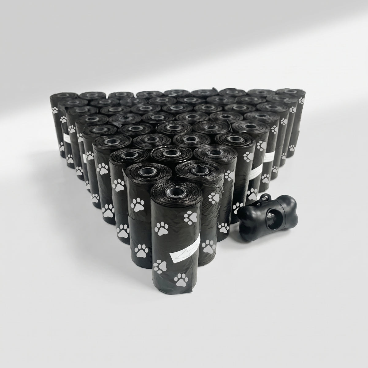 Dog Poop Bags, 5 Rolls with Bone Dispenser, studio photo on a light grey background
