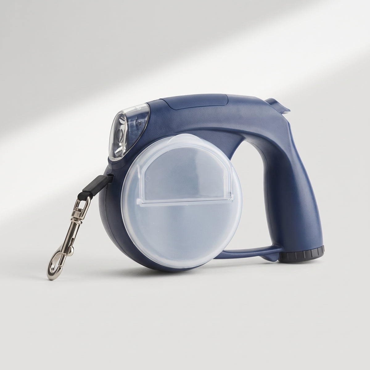 All in One Retractable Leash with Flashlight, studio photo on a light grey background