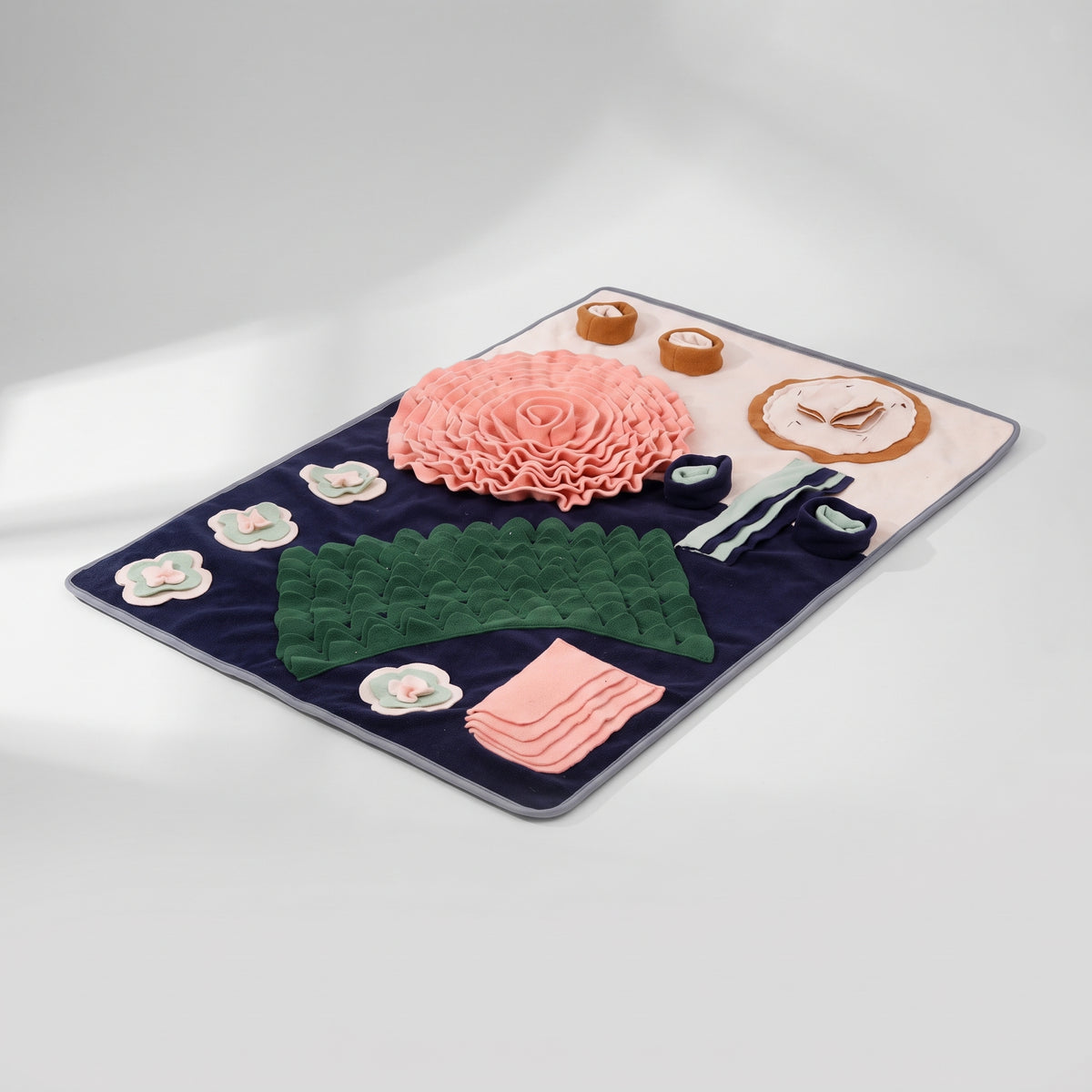 Dog Snuffle Mat in Flower and Food Shapes, studio photo on a light grey background