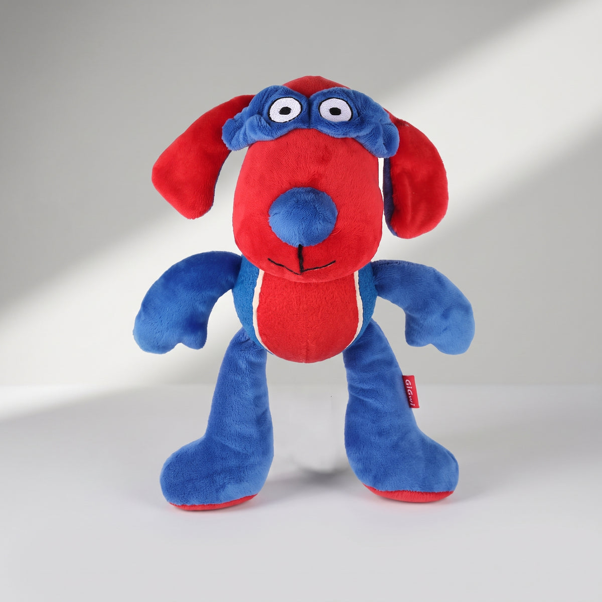 Squeaky Dog Toy in Elephant or Hippo Design, studio photo on a light grey background