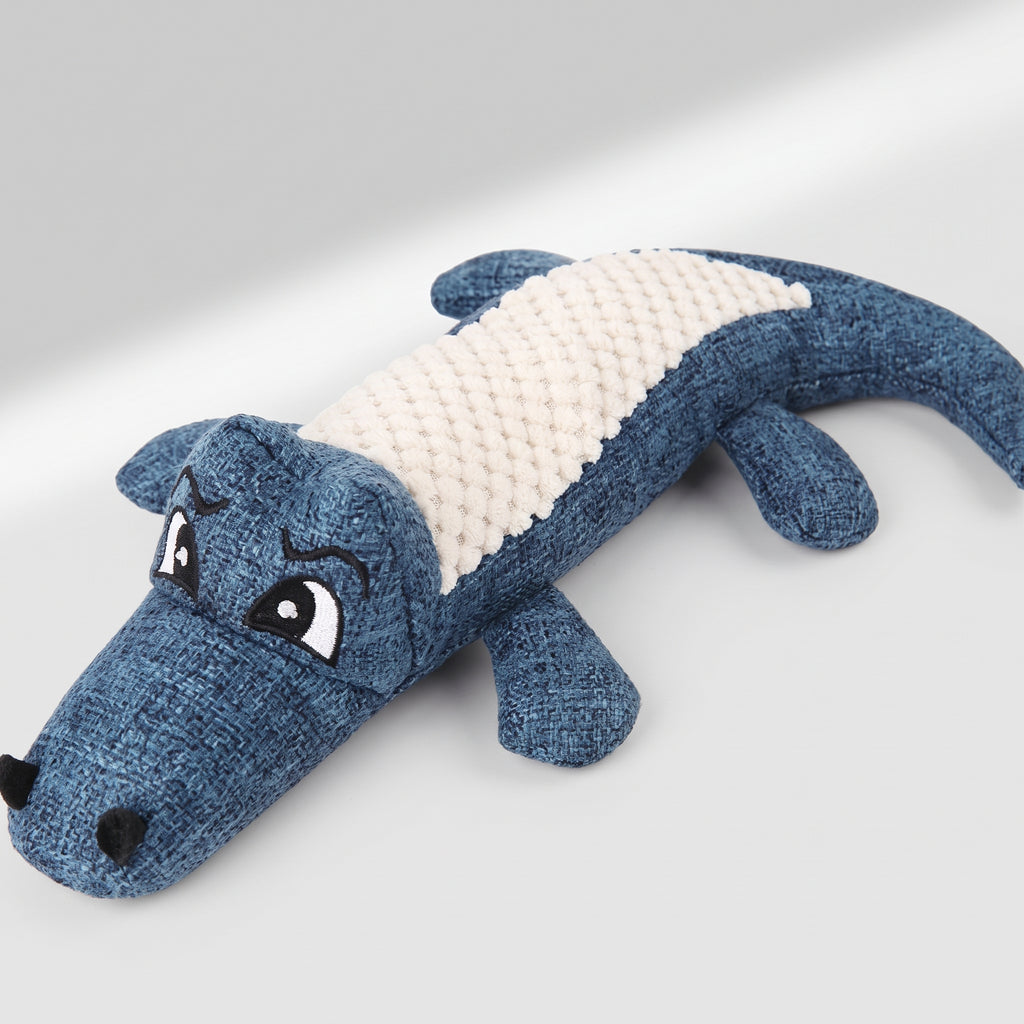 Dog Toy Alligator, studio photo on a light grey background