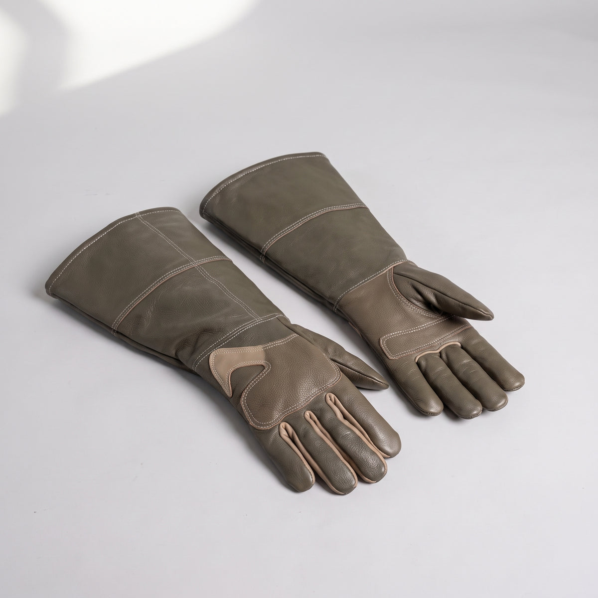 Dog Training Gloves, studio photo on a light grey background
