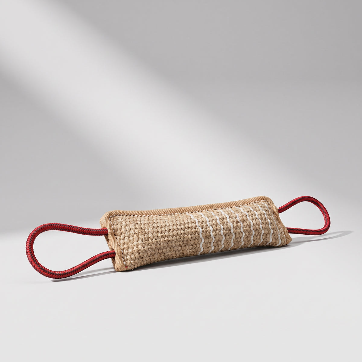 Dog Tug Toy, studio photo on a light grey background