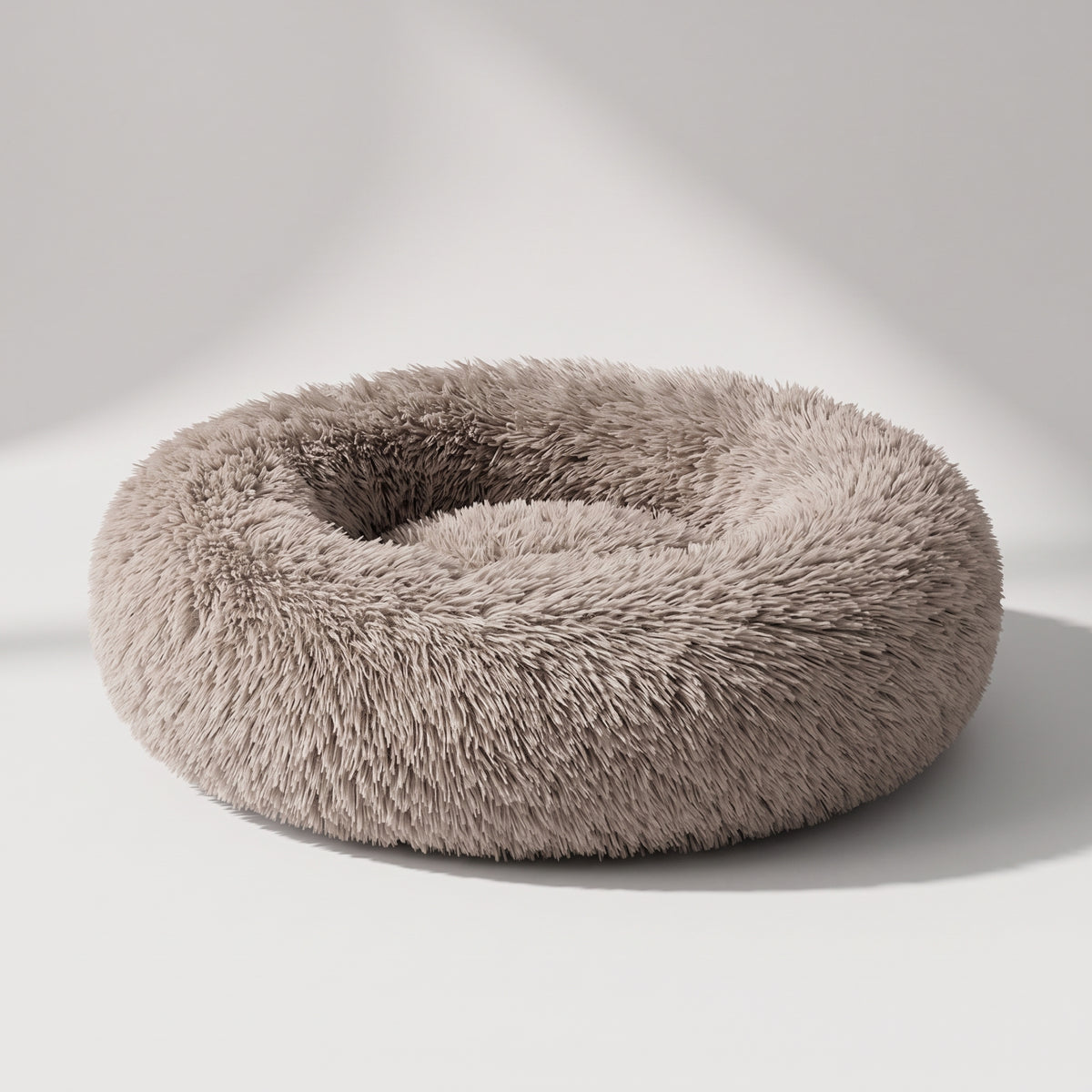Fluffy Donut Dog Bed, studio photo on a light grey background