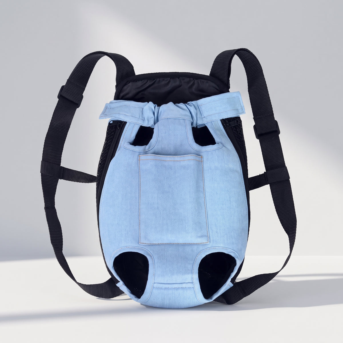 Front Backpack Dog Carrier, studio photo on a light grey background