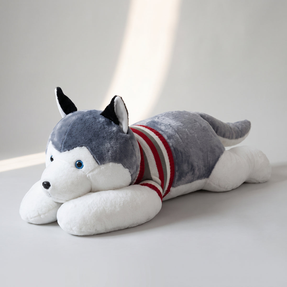 Large Husky Plush Toy, studio photo on a light grey background