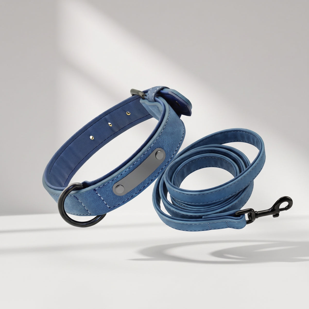 Personalized Leather Dog Collar and Leash, studio photo on a light grey background