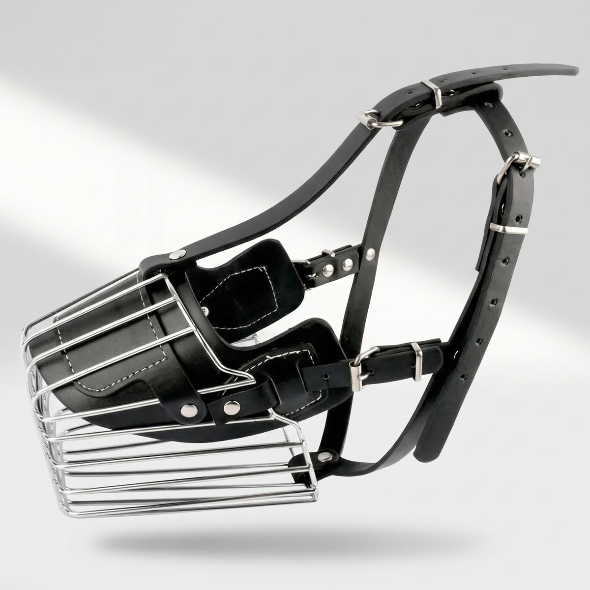 Metal Basket Dog Muzzle, studio photo on a light grey background