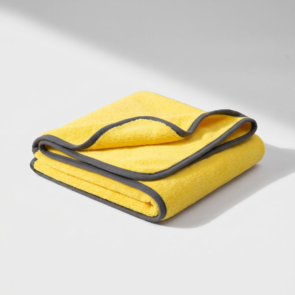 Yellow Microfiber Dog Towel in Three Sizes, studio photo on a light grey background