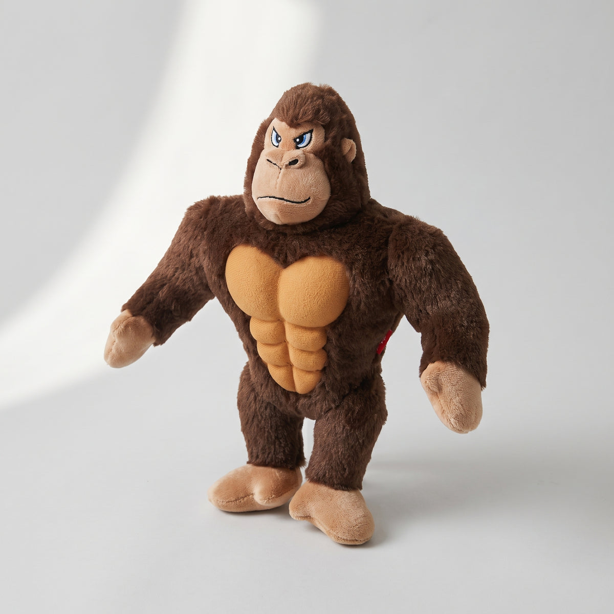 Plush Dog Toy, studio photo on a light grey background