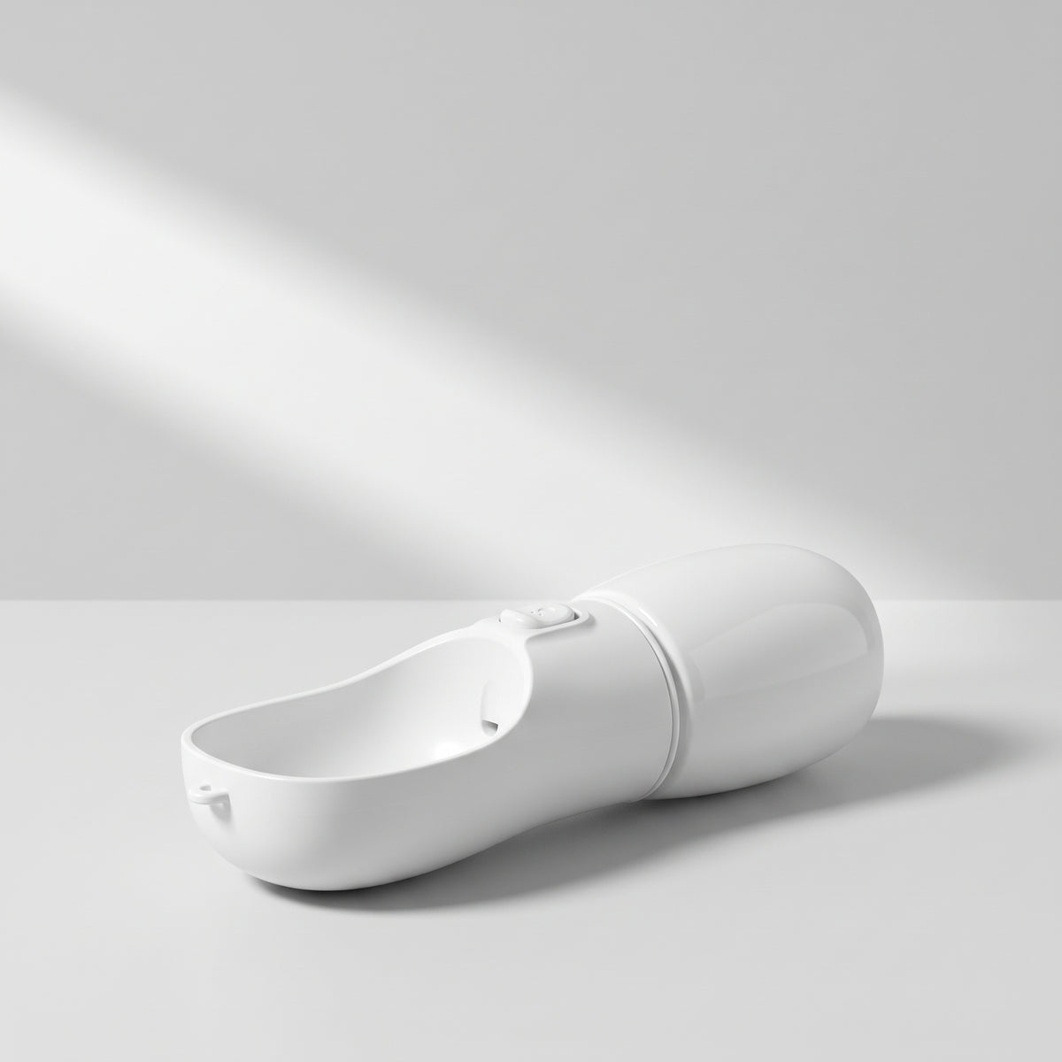 Portable Dog Water Bottle for Walks, studio photo on a light grey background