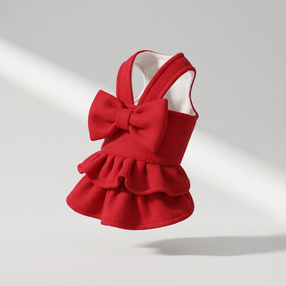 Red Dog Dress, studio photo on a light grey background