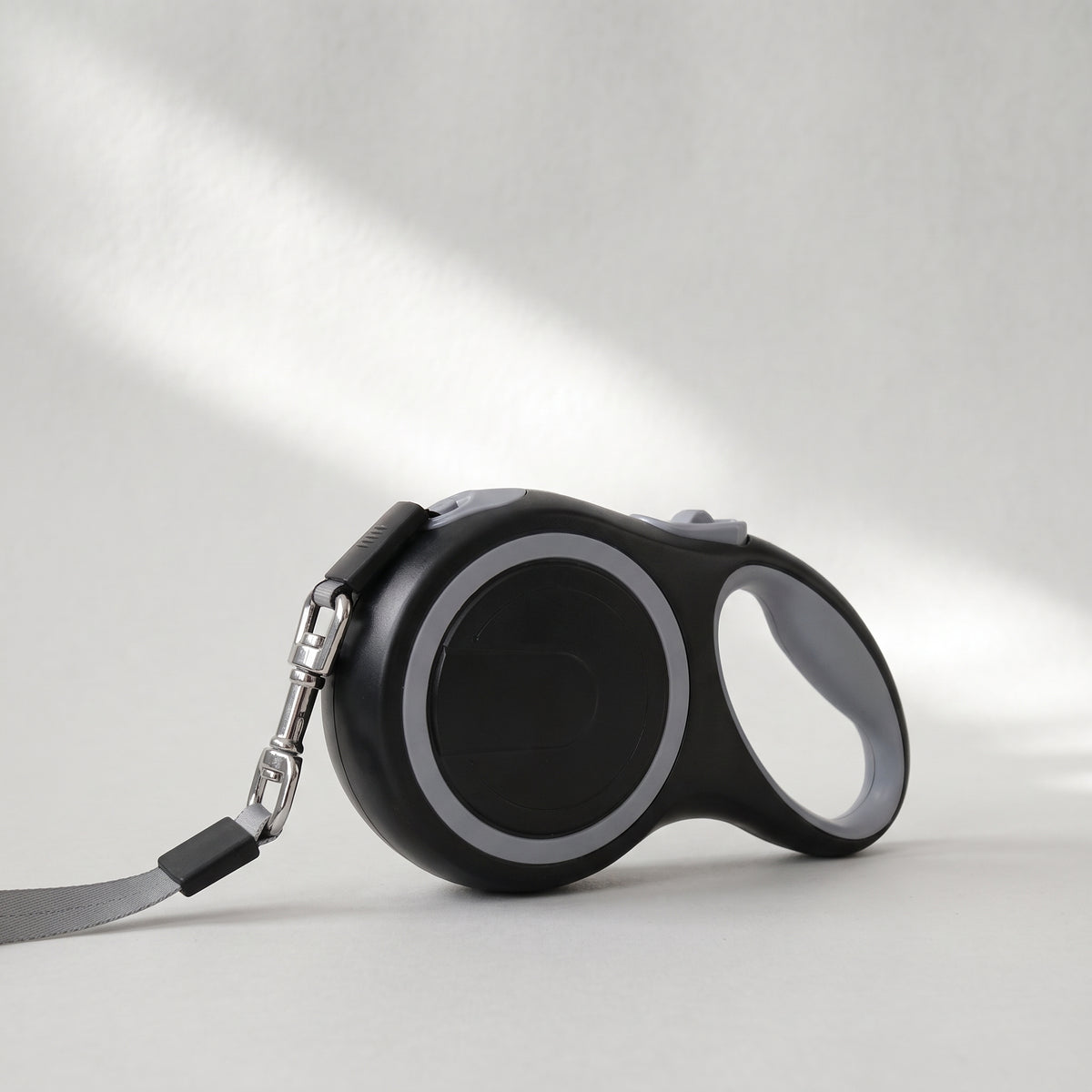 Retractable Dog Leash, 3 to 8 Meters, studio photo on a light grey background