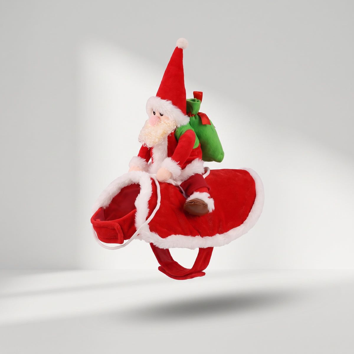 Santa Riding Dog Costume, studio photo on a light grey background