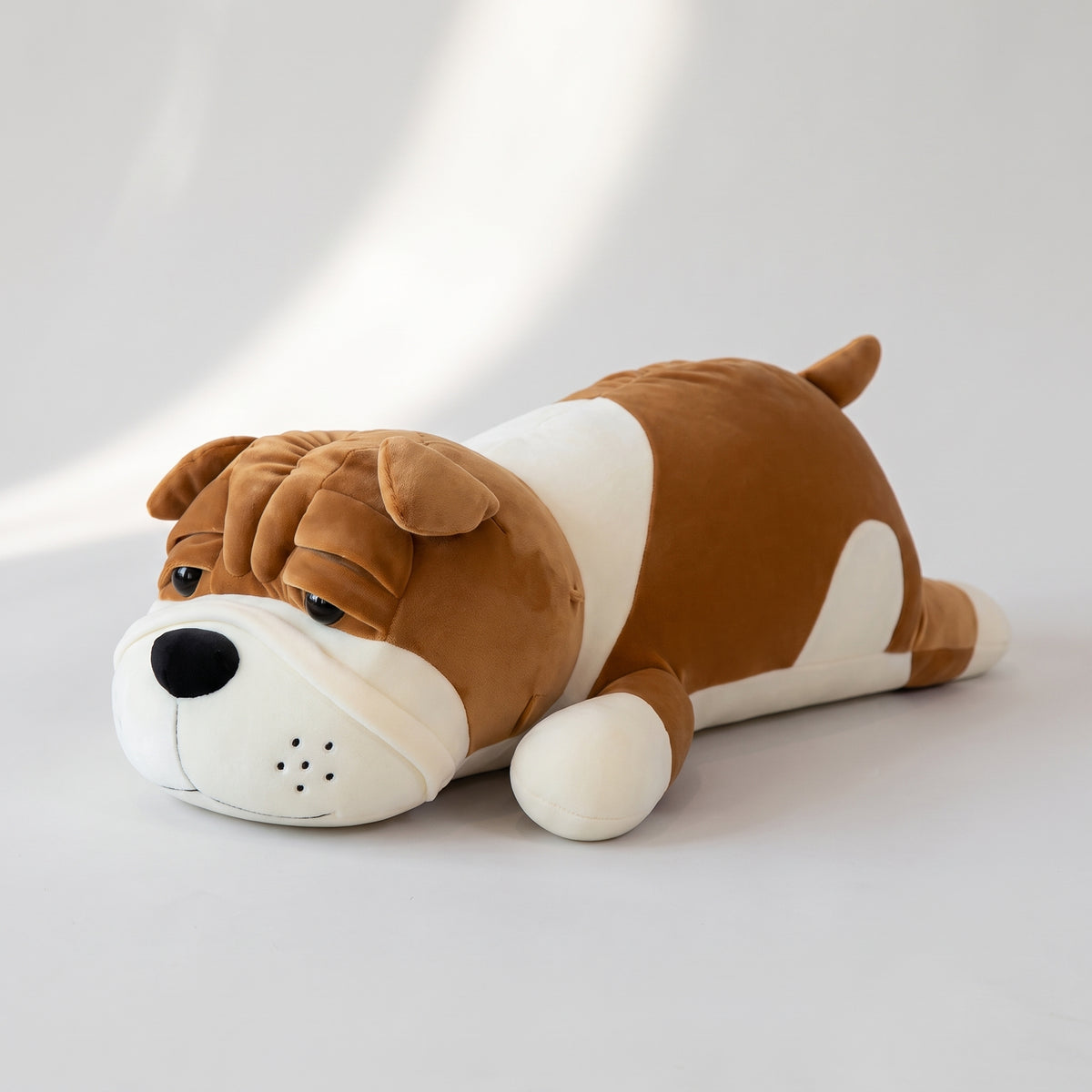 Shar Pei Plush Toy, studio photo on a light grey background