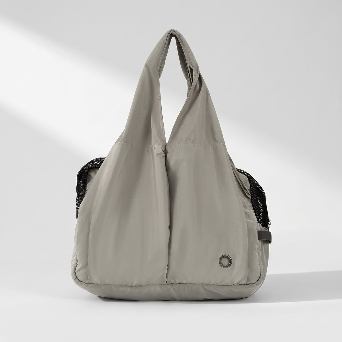 Small Dog Carrying Sling, studio photo on a light grey background