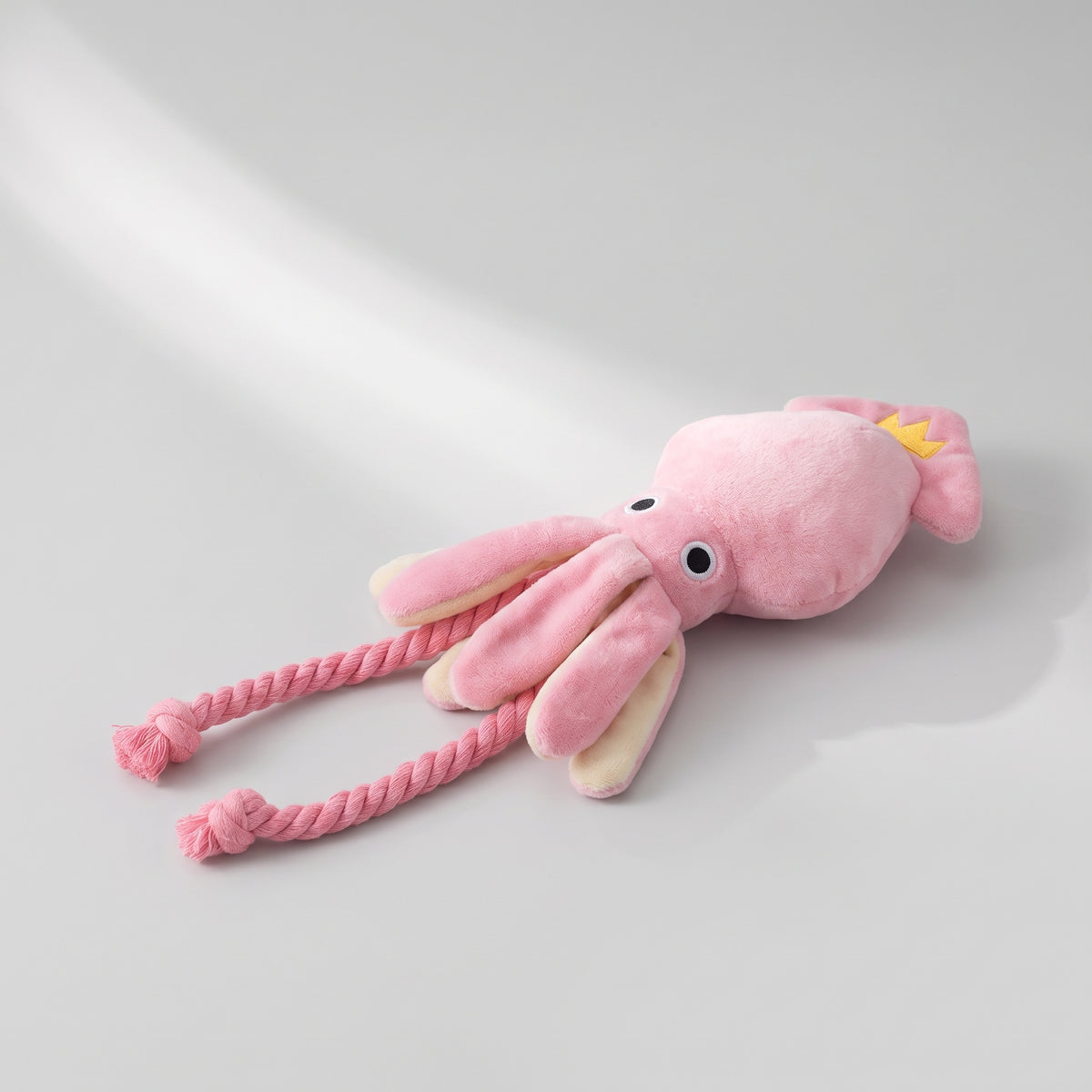 Pink Squeaky Toy for Small Dogs, studio photo on a light grey background