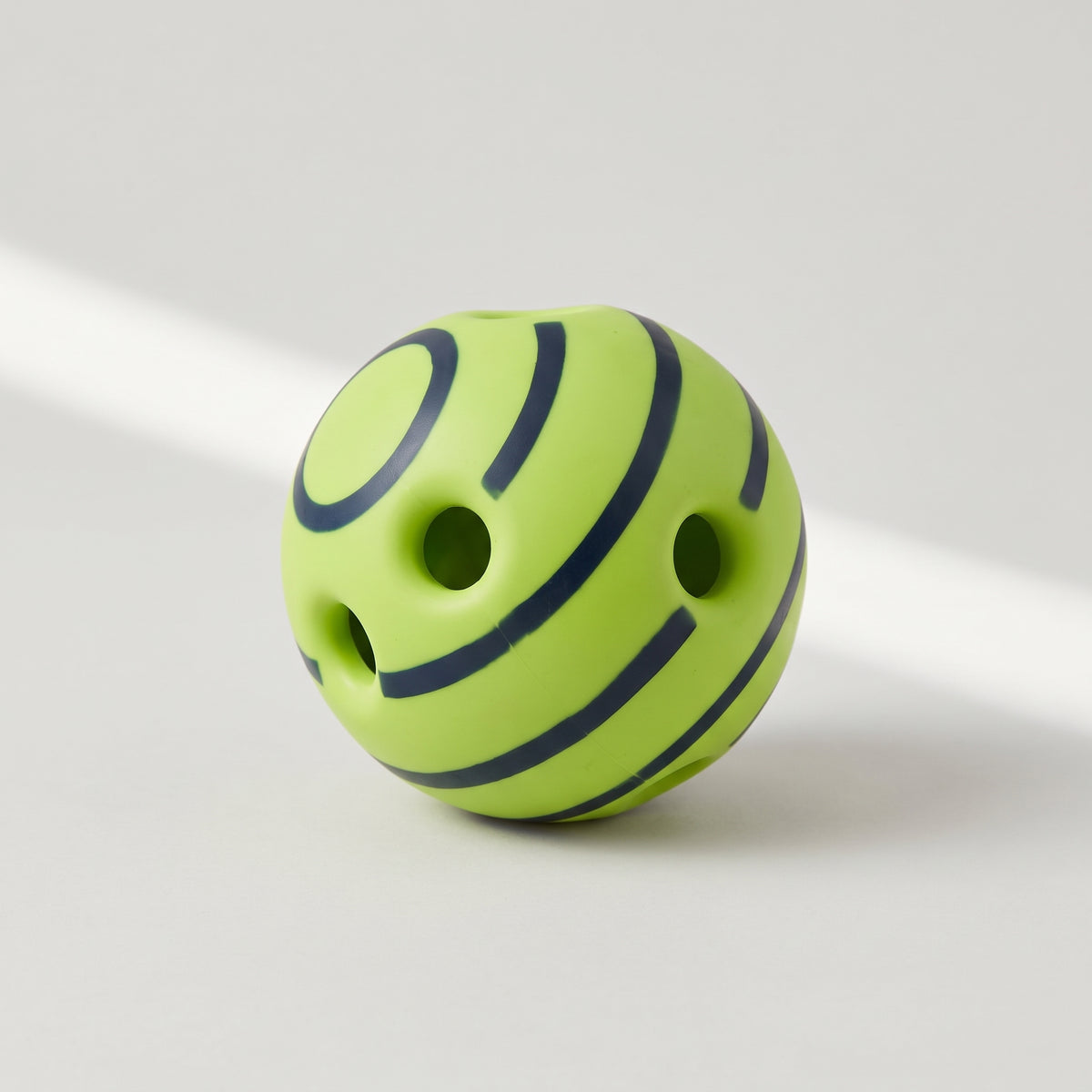 Giggle Sound Interactive Dog Ball, studio photo on a light grey background